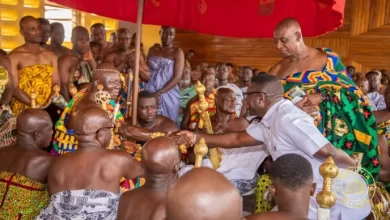 CEO of Opportunity International Savings and Loans exchanging pleasantries with Otumfuo Osei Tutu II at the Akwasidae Festival