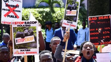 Ugandan activists march in Kampala, Uganda, in support of a European Parliament resolution to stop the construction of the East African Crude Oil Pipeline on environmental grounds [File: Abubaker Lubowa/Reuters]