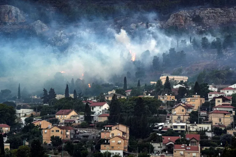 Smoke and fire covers an area near Kiryat Shmona in northern Israel after a Hezbollah attack earlier this month [Ayal Margolin/Reuters]