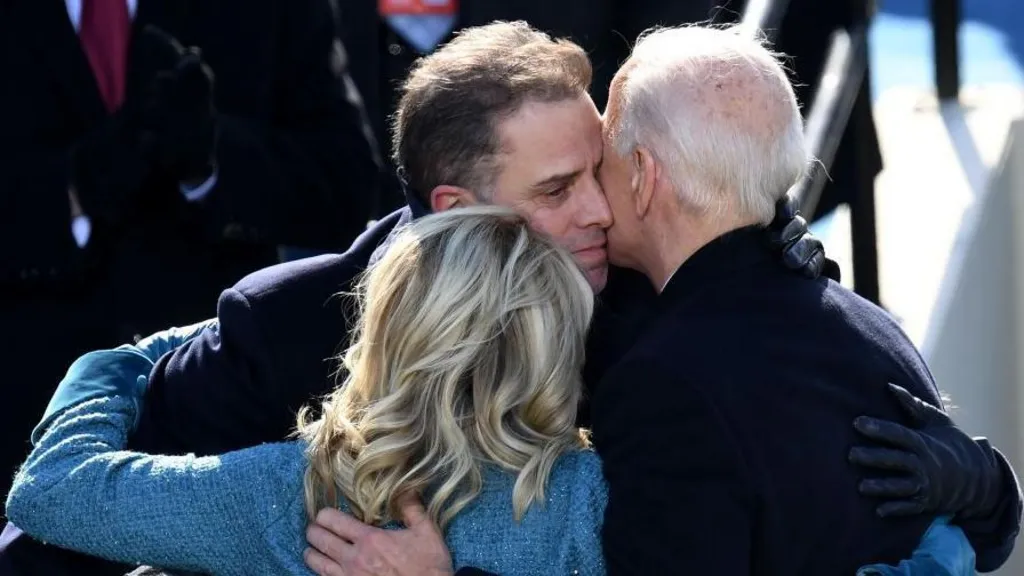 President Biden hugs his son, Hunter, and First Lady Jill Biden after his inauguration