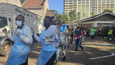 Doctors leave a medical camp they set up for protesters in a Nairobi cathedral after being forced out by military personnel