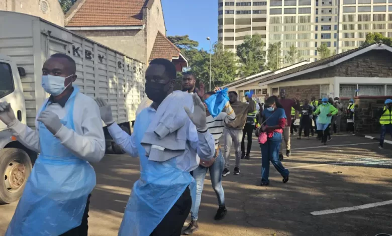 Doctors leave a medical camp they set up for protesters in a Nairobi cathedral after being forced out by military personnel