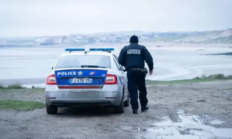 File photo of a French Police officer looking out over a beach in France