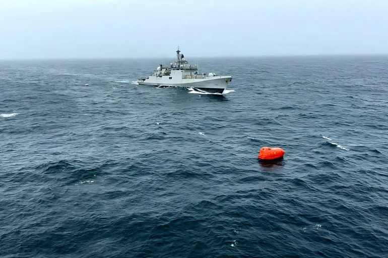 An Indian Navy frigate heads towards a lifeboat with nine crew from the capsized MT Prestige Falcon, July 17 [Handout/Indian Navy via X]