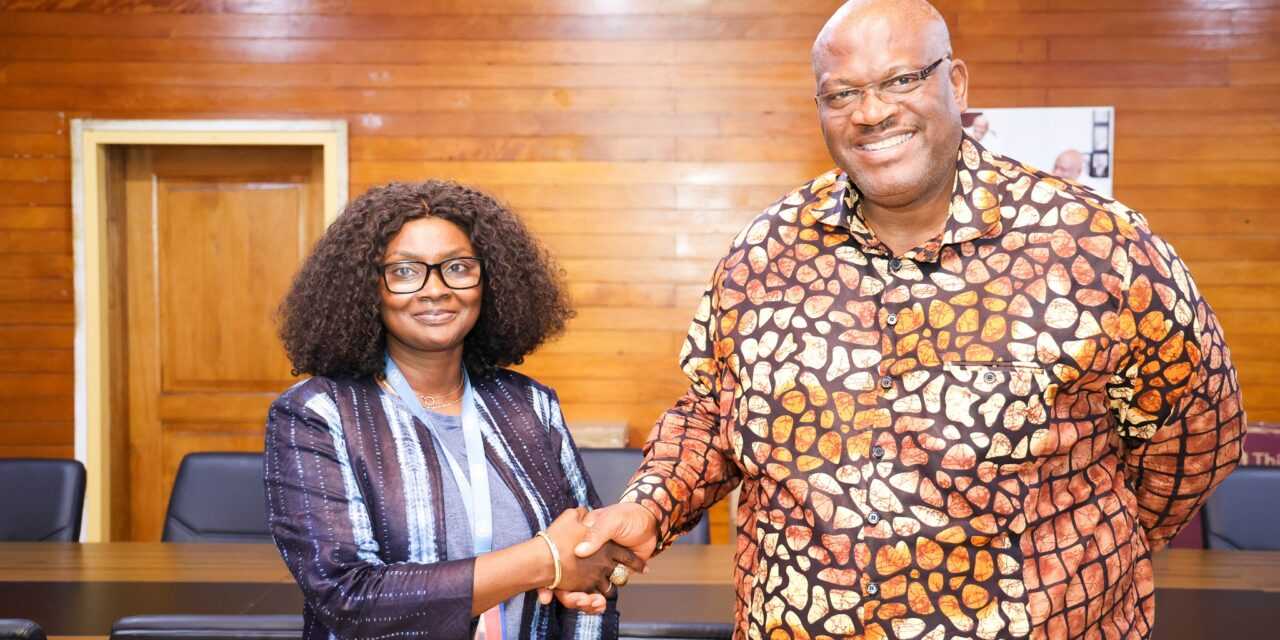 IOM Chief in a hand shake with interior minister of Ghana