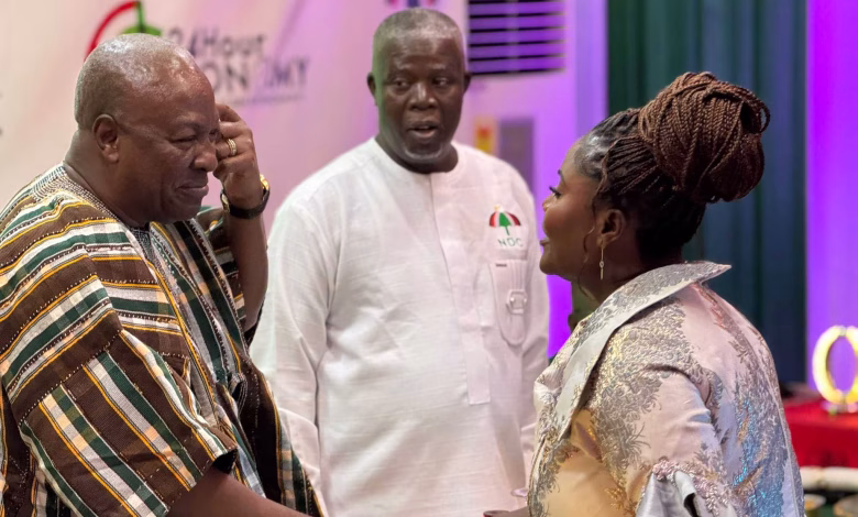 John Mahama in a handshake with Madam Affo Toffey