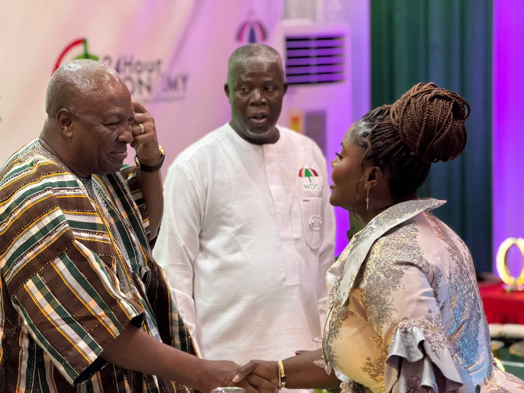 John Mahama in a handshake with Madam Affo Toffey