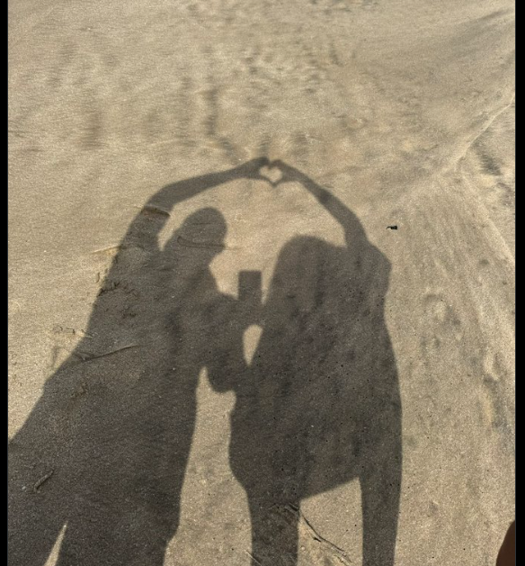 Medikal with a new lover in a mysterious beach photo