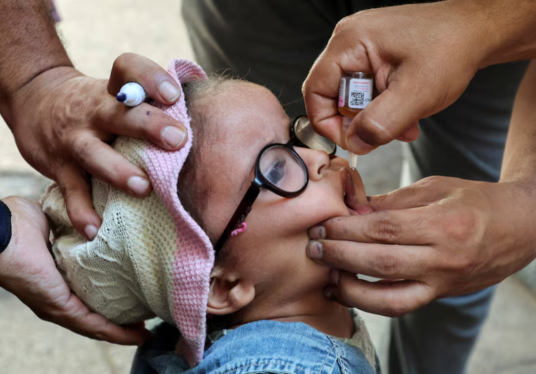 A Palestinian child vaccinated against polio,in Deir Al Balah,central Gaza strip.