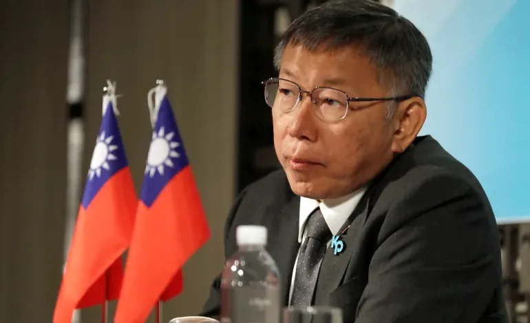 Taiwan People's Party presidential candidate Ko Wen-je listens during a news conference in Taipei