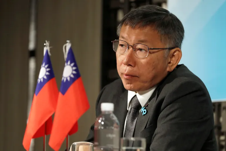 Taiwan People's Party presidential candidate Ko Wen-je listens during a news conference in Taipei