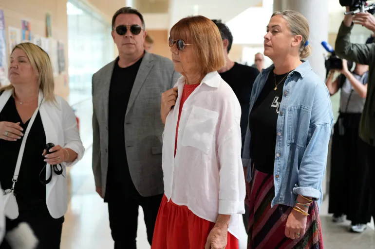 Gisele Pelicot, centre, arrives at the Avignon court in southern France to testify