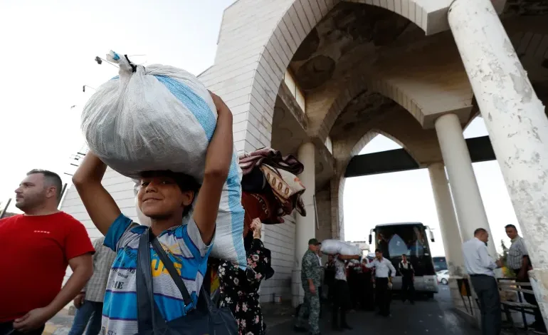 A Syrian boy fleeing the war in Lebanon with his family