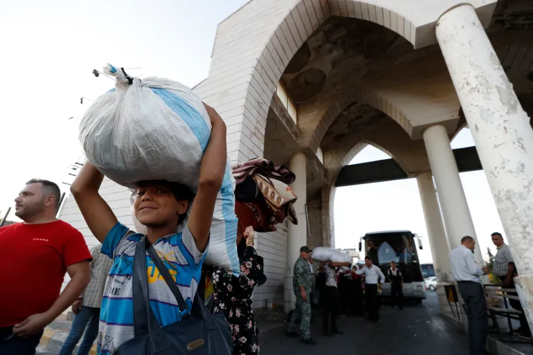 A Syrian boy fleeing the war in Lebanon with his family