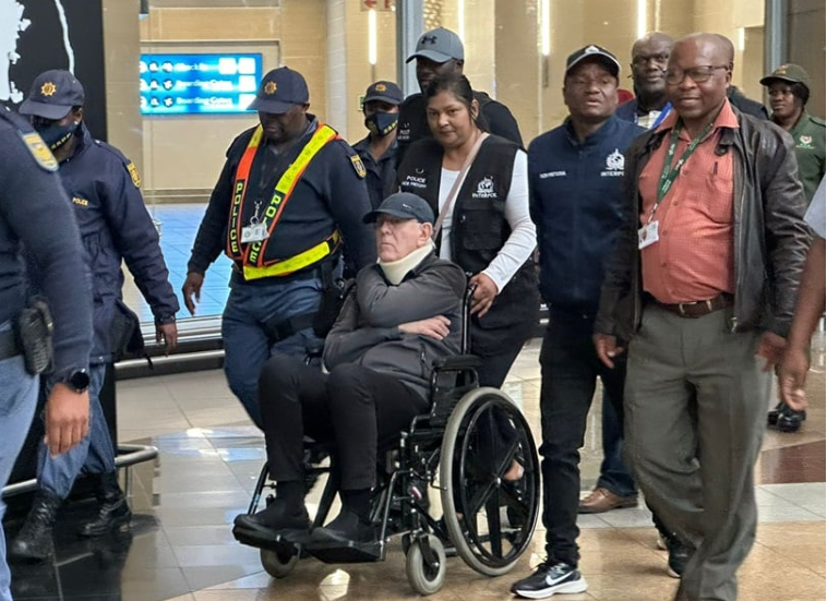 Ex-Eskom contarctor,Michael Lomas arrives in South Africa in a wheel chair