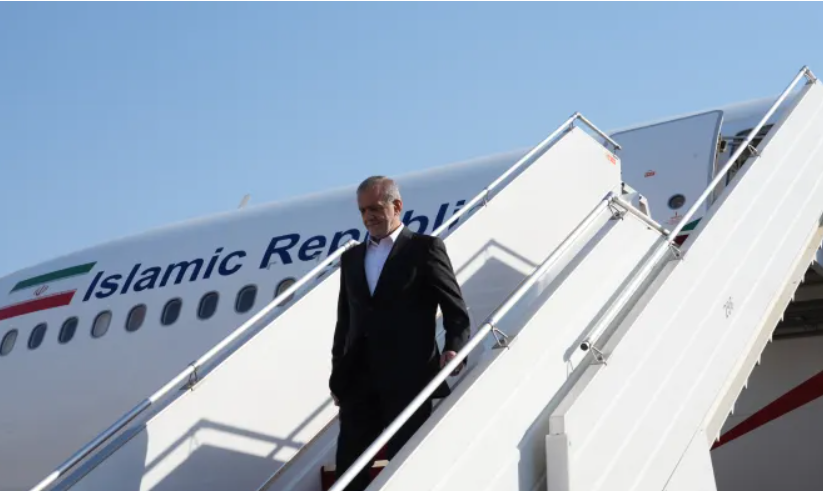 Masoud Pezeshkian disembarks from his plane upon landing in Baghdad