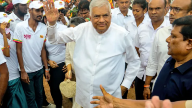 Sri Lanka's president and presidential candidate Ranil Wickremesinghe greets his supporters during an election rally