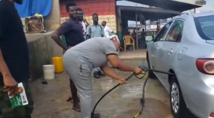 Phillis Naa Koryoo Okunor washing cars at a bay