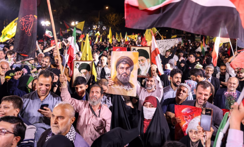 A crowd celebrating the iranian strikes on Tuesday in Tehran.