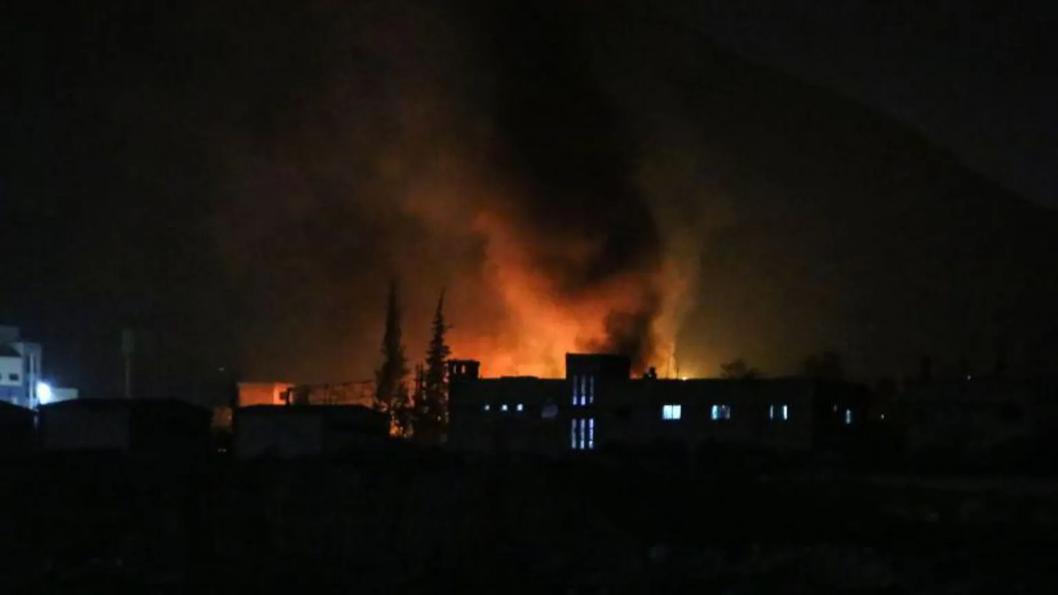 Smoke billows from a strike near Damascus on Monday night